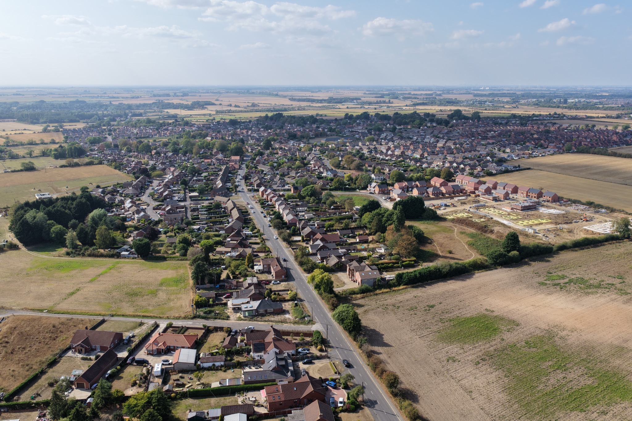 Wide aerial view of village and countryside
